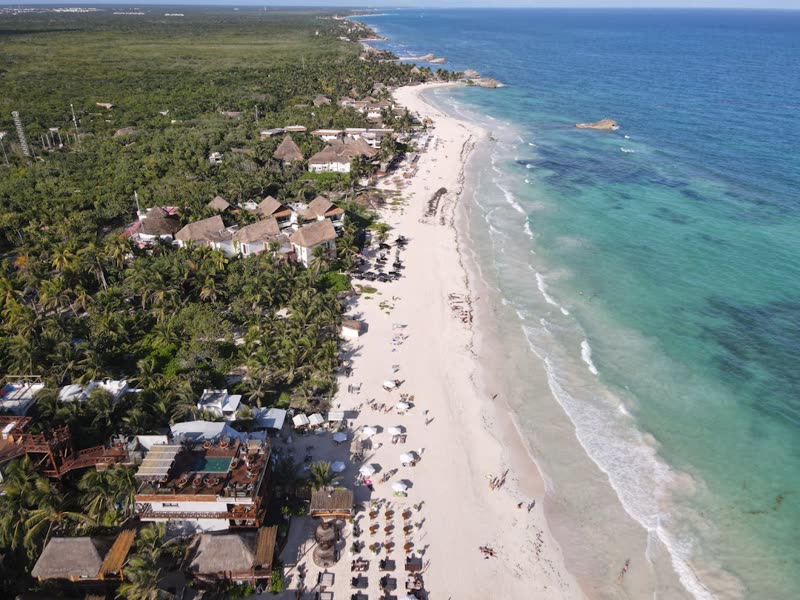 Aerial view of a Mexican Caribbean beach resort strip — corporate retreat destination